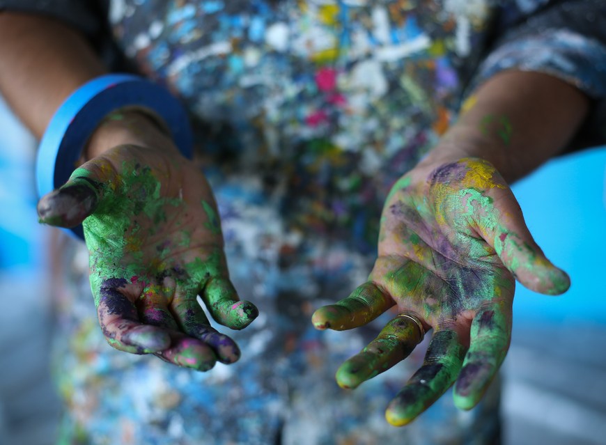 Paint covered hands