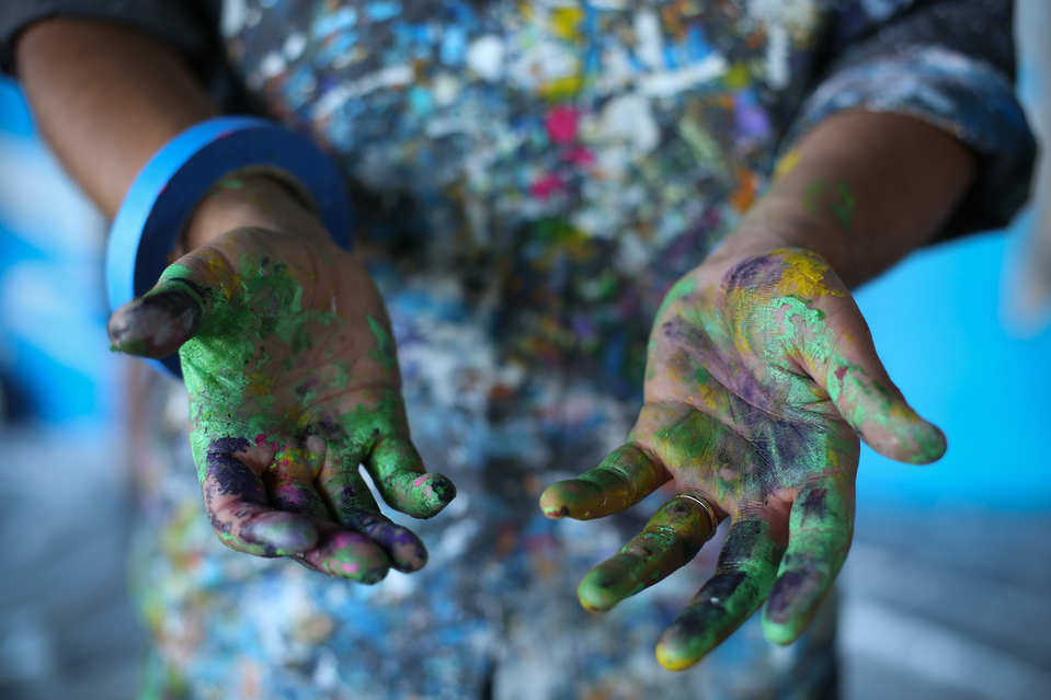 Paint covered hands